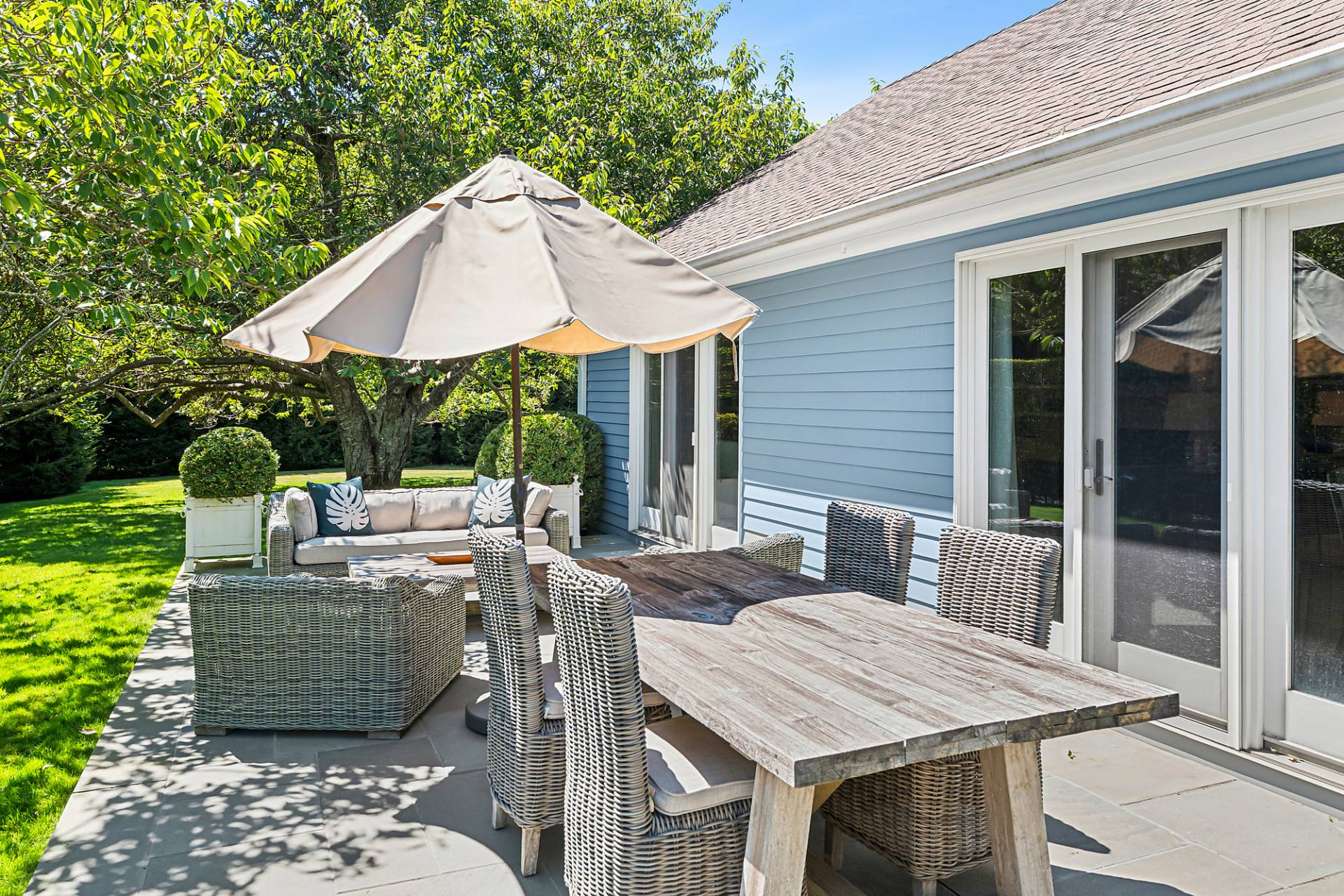 1 Egypt Close East Hampton, NY 11937 - Photo 30 of 38 a view of a patio with table and chairs under an umbrella
