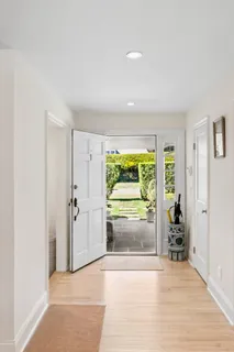 wooden floor in an empty room with a fireplace