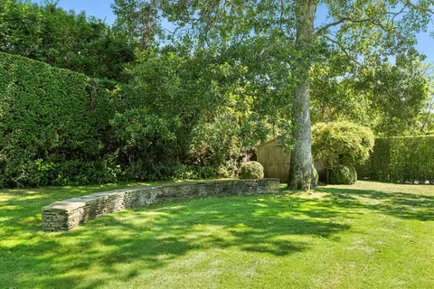 a view of outdoor space with trees all around
