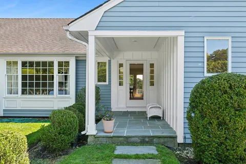 front view of a house with a yard