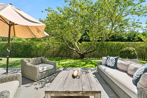 swimming pool view with a seating space