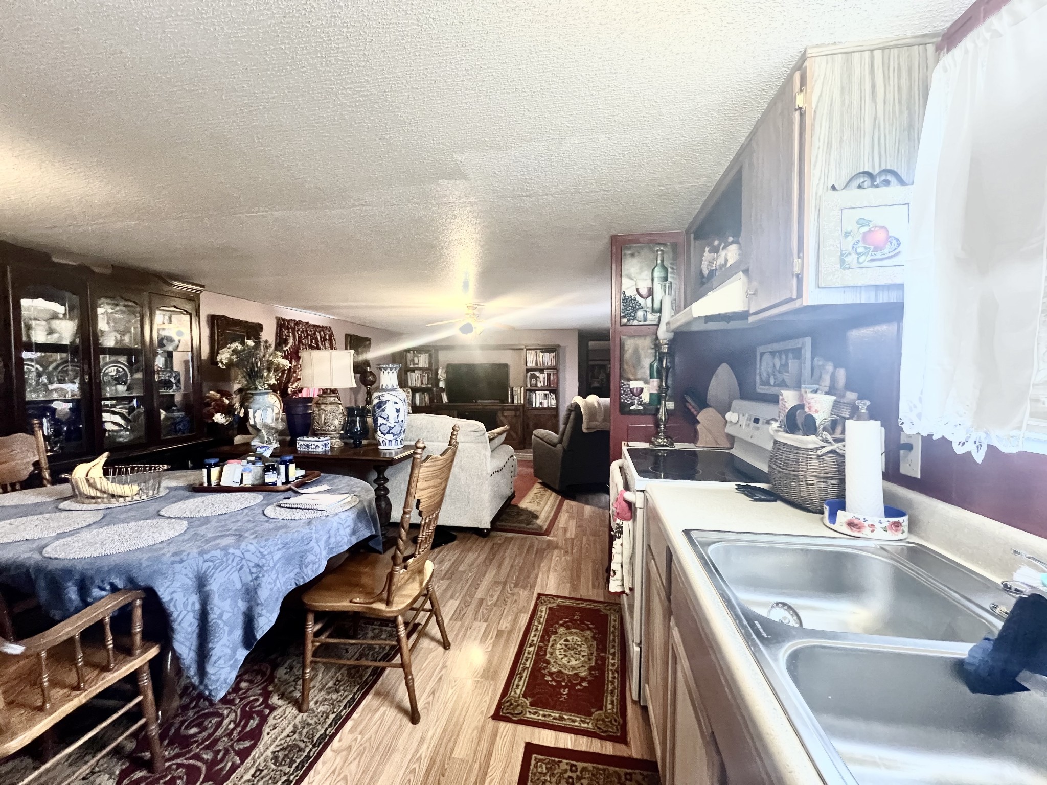 15 Red House Road Elora, TN 37328 - Photo 11 of 21 a kitchen with stainless steel appliances granite countertop a sink counter space and living room view