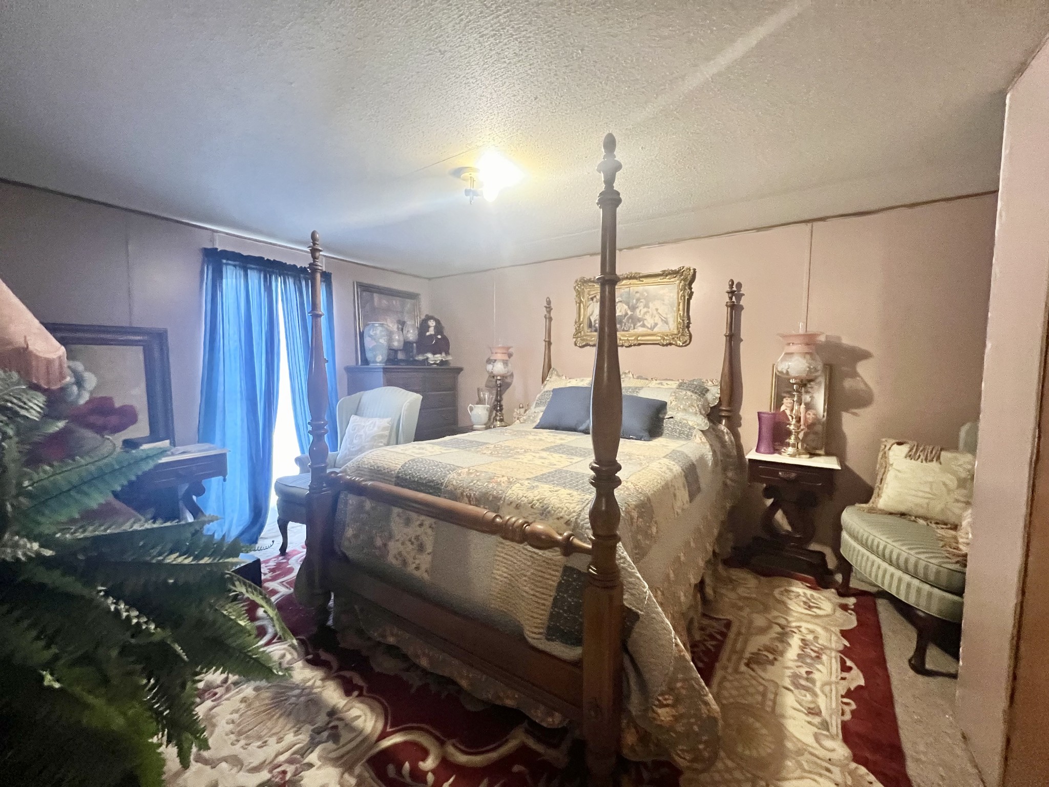 15 Red House Road Elora, TN 37328 - Photo 18 of 21 a bed room with a bed and a lamp