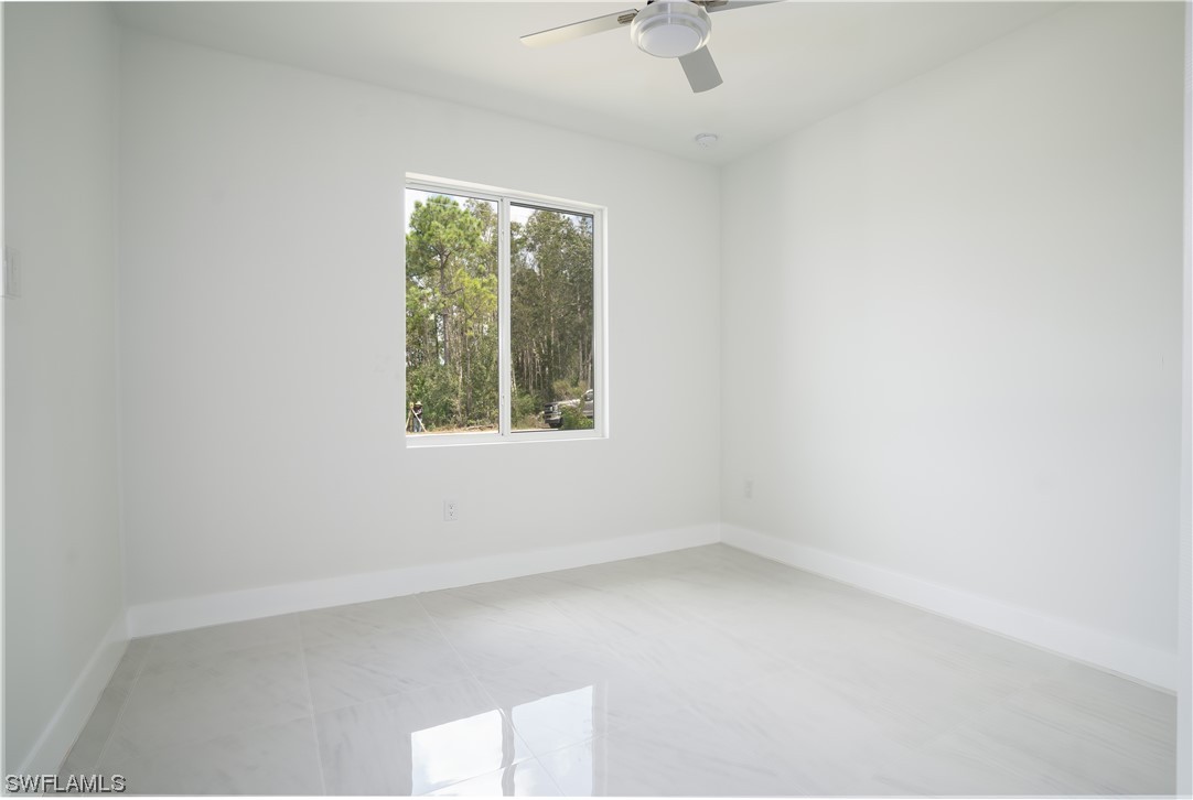 3233 Ruth Lane Lehigh Acres, FL 33976 - Photo 14 of 23 an empty room with a window