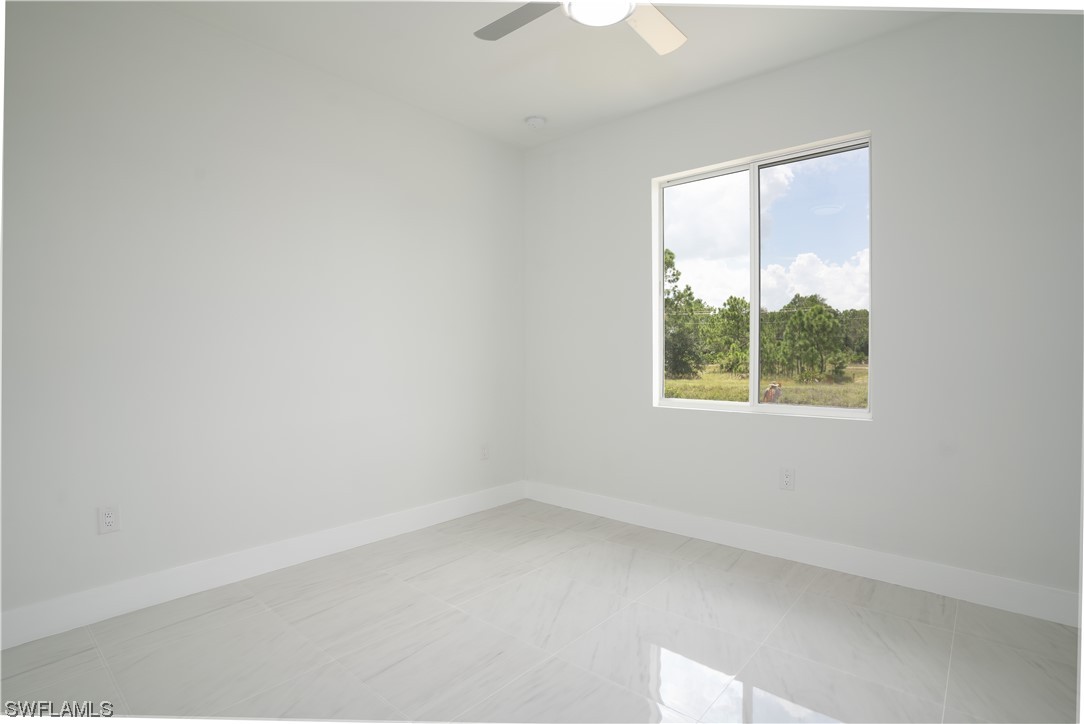 3233 Ruth Lane Lehigh Acres, FL 33976 - Photo 15 of 23 an empty room with a window