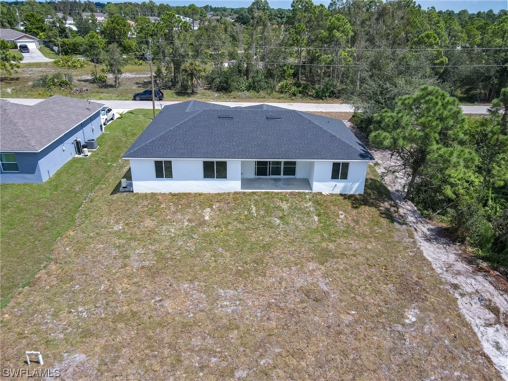 3233 Ruth Lane Lehigh Acres, FL 33976 - Photo 17 of 23 an aerial view of a house