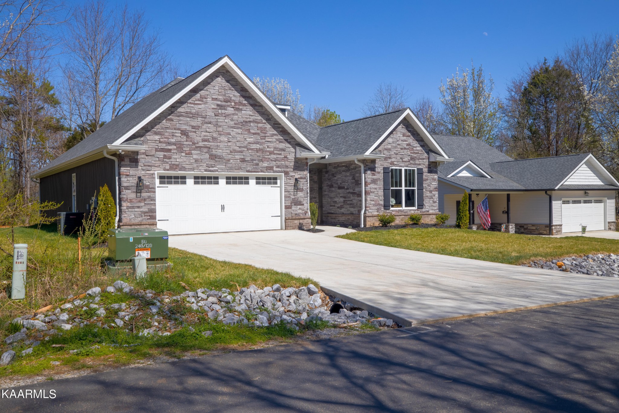 162 Tsuhdatsi Way Loudon, TN 37774 - Photo 2 of 38 a front view of a house with a garden and yard