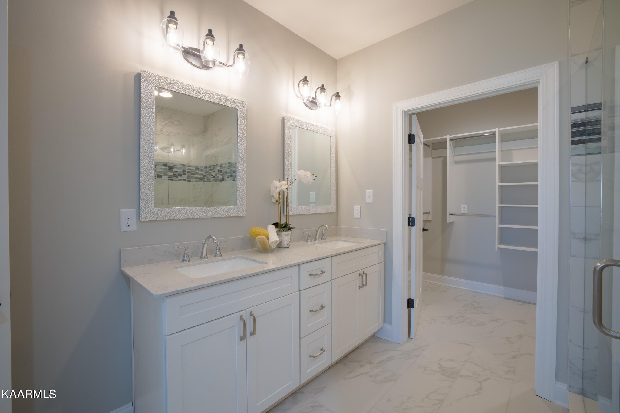 162 Tsuhdatsi Way Loudon, TN 37774 - Photo 25 of 38 a bathroom with a double vanity sink a mirror and a shower