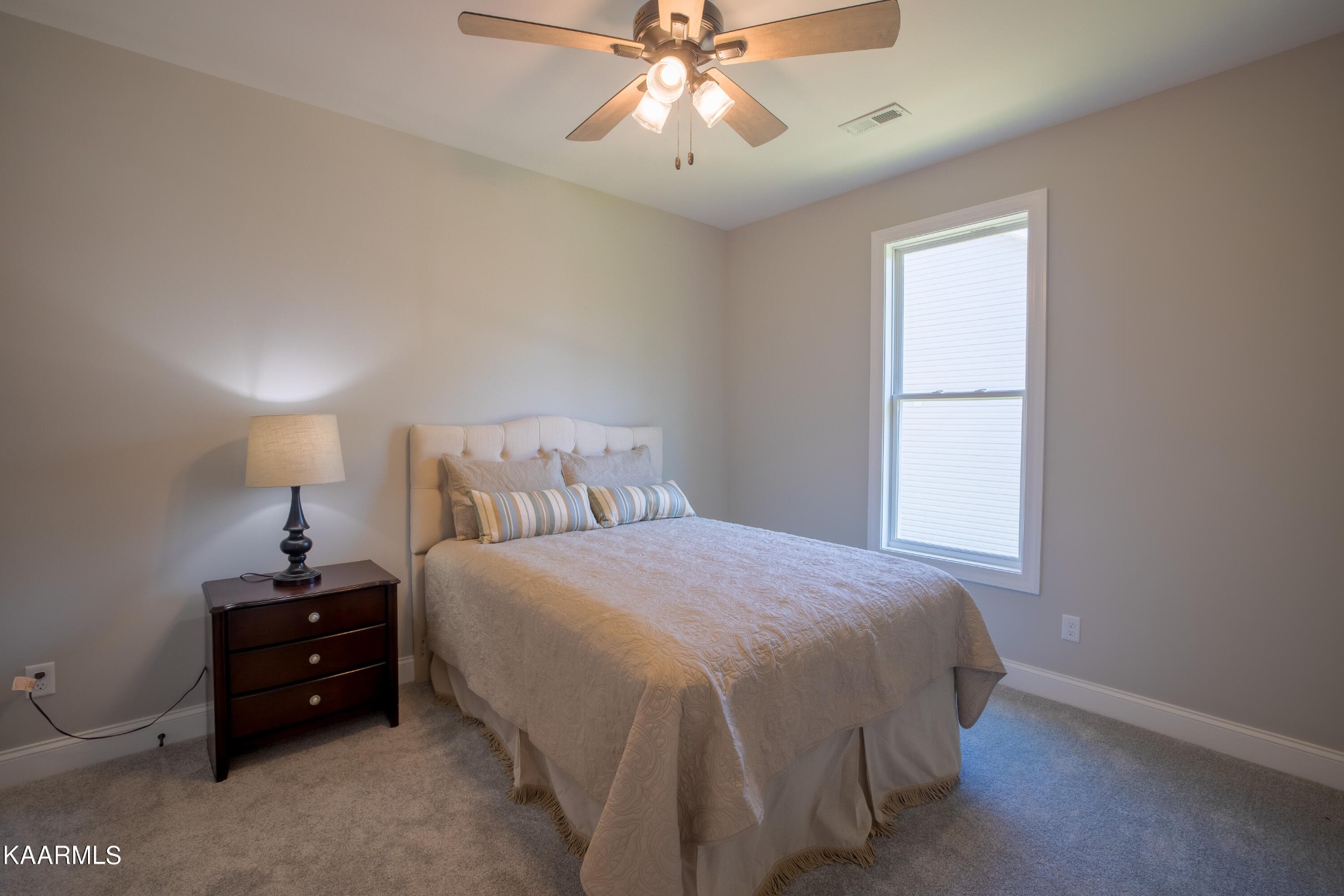 162 Tsuhdatsi Way Loudon, TN 37774 - Photo 27 of 38 a bedroom with a bed and a window