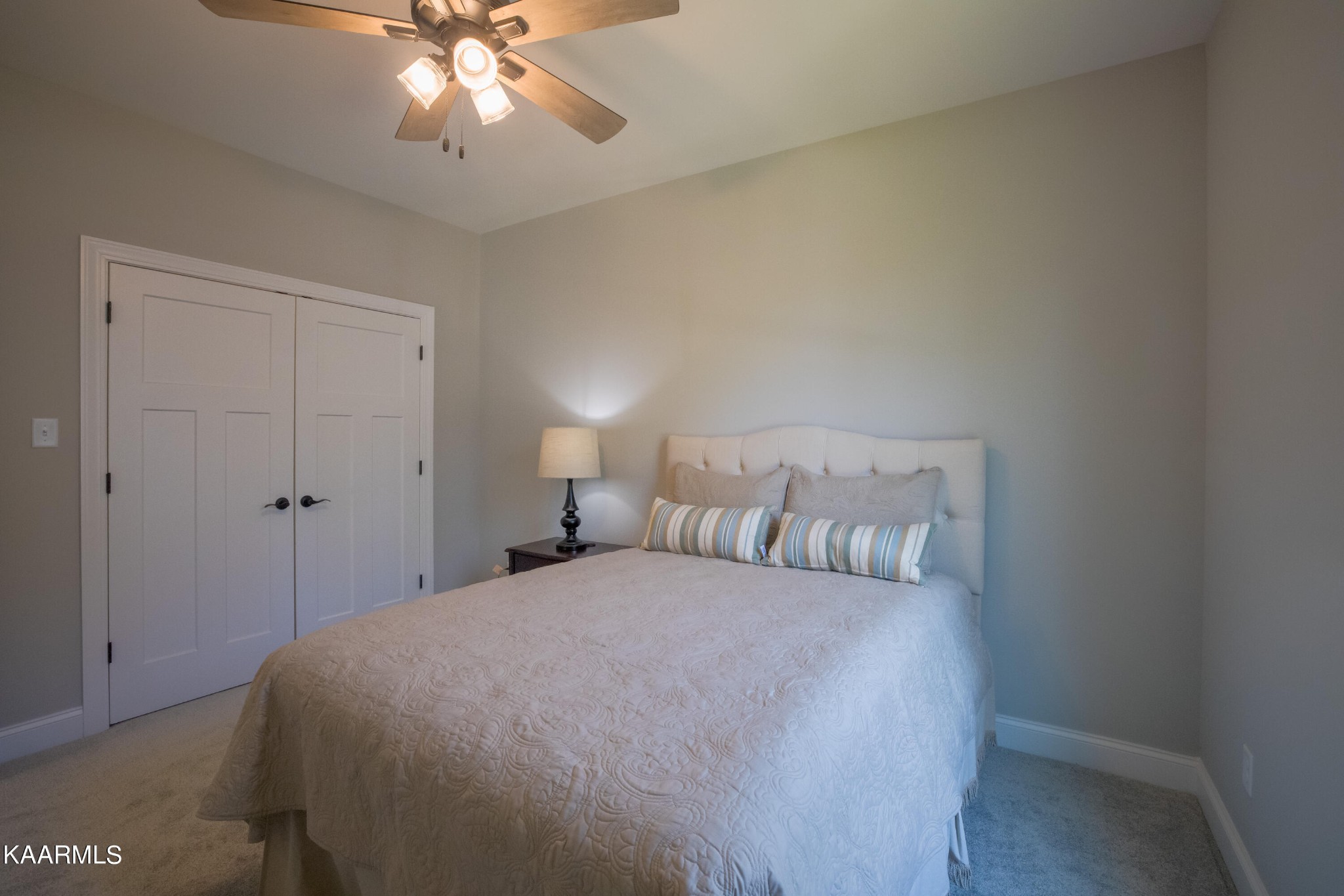 162 Tsuhdatsi Way Loudon, TN 37774 - Photo 29 of 38 a bedroom with a large bed and a chandelier