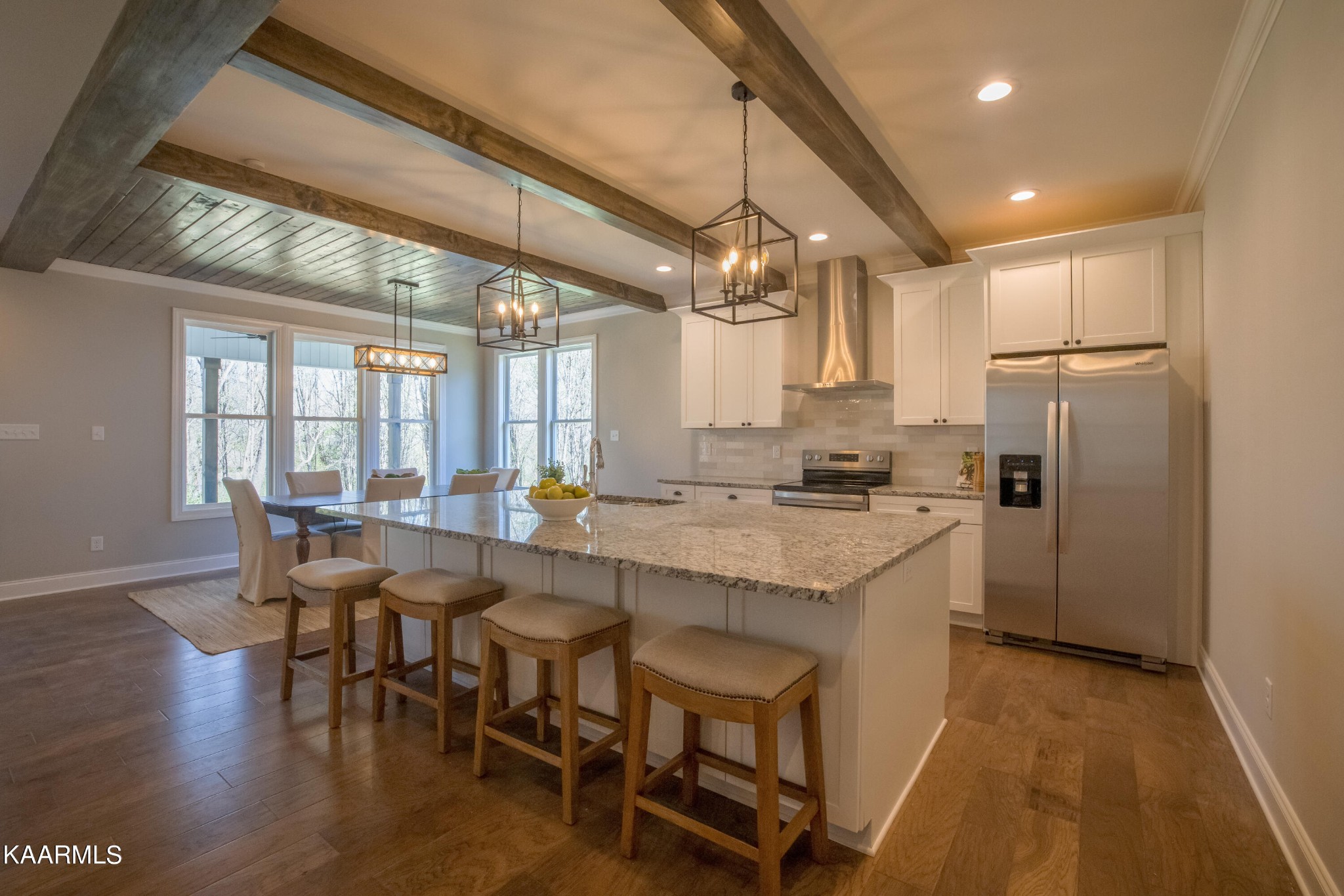 162 Tsuhdatsi Way Loudon, TN 37774 - Photo 6 of 38 a kitchen with a table chairs refrigerator and wooden floor