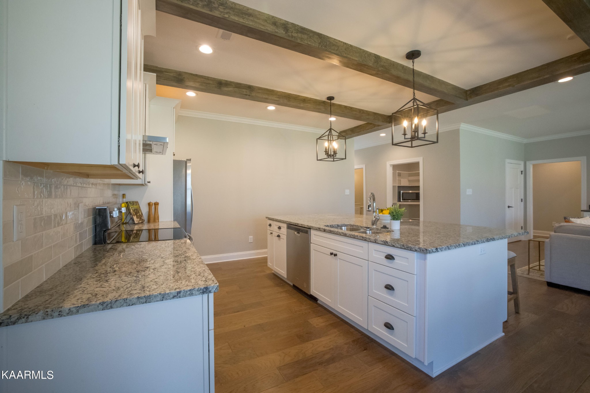 162 Tsuhdatsi Way Loudon, TN 37774 - Photo 10 of 38 a kitchen with granite countertop a sink stove and refrigerator