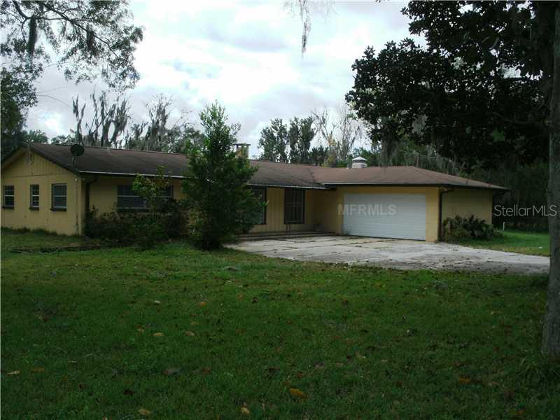 22230 Hale Road Land O' Lakes, FL 34639 - Photo 1 of 1 a view of a house with yard and a garden