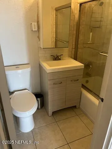 a bathroom with a sink toilet and a mirror