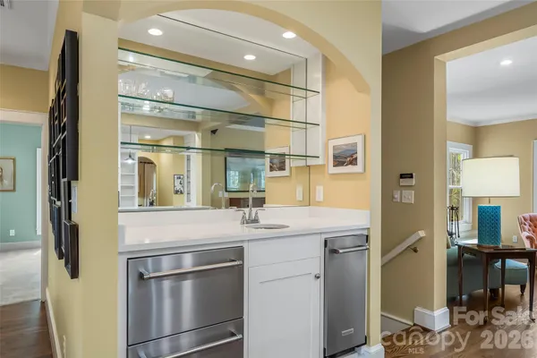 a kitchen with stainless steel appliances a refrigerator and cabinets