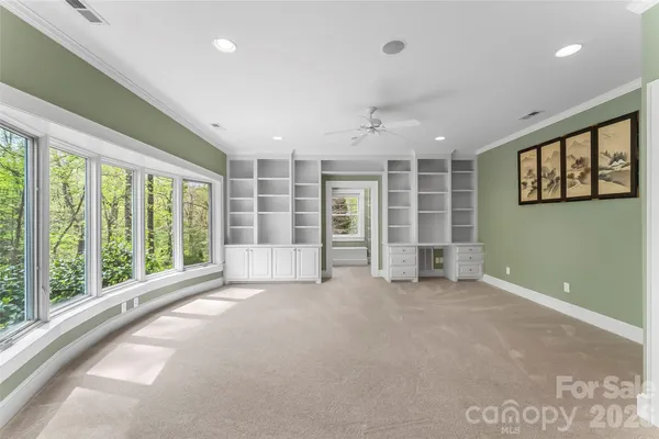 a view of an empty room with a balcony