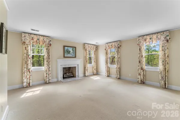 a view of a livingroom with furniture and a fireplace