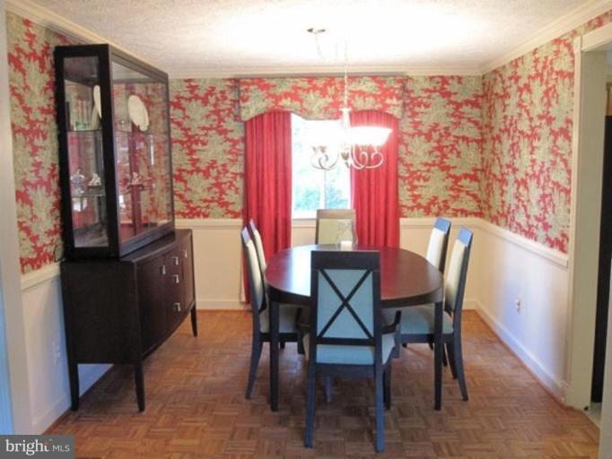 4438 Cub Run Road Chantilly, VA 20151 - Photo 4 of 16 a view of a dining room with furniture and chandelier