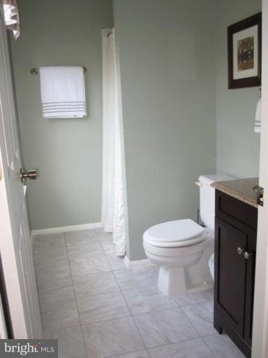 4438 Cub Run Road Chantilly, VA 20151 - Photo 10 of 16 a bathroom with a toilet and a vanity