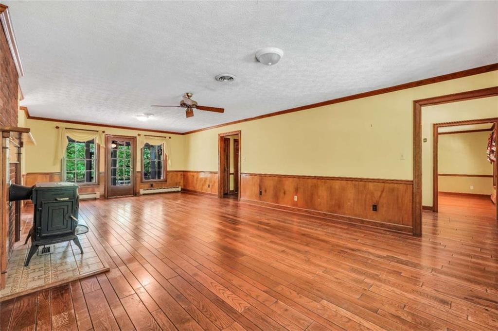 314 Winding Stream Trail Southwest Conyers, GA 30094 - Photo 19 of 59 a view of an empty room with wooden floor and a window