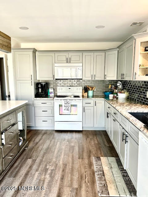 8 Diane Road Manahawkin, NJ 08050 - Photo 5 of 11 a kitchen with stainless steel appliances a white stove top oven sink and cabinets