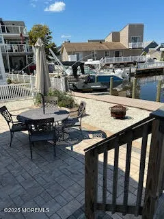 a view of a patio with table and chairs