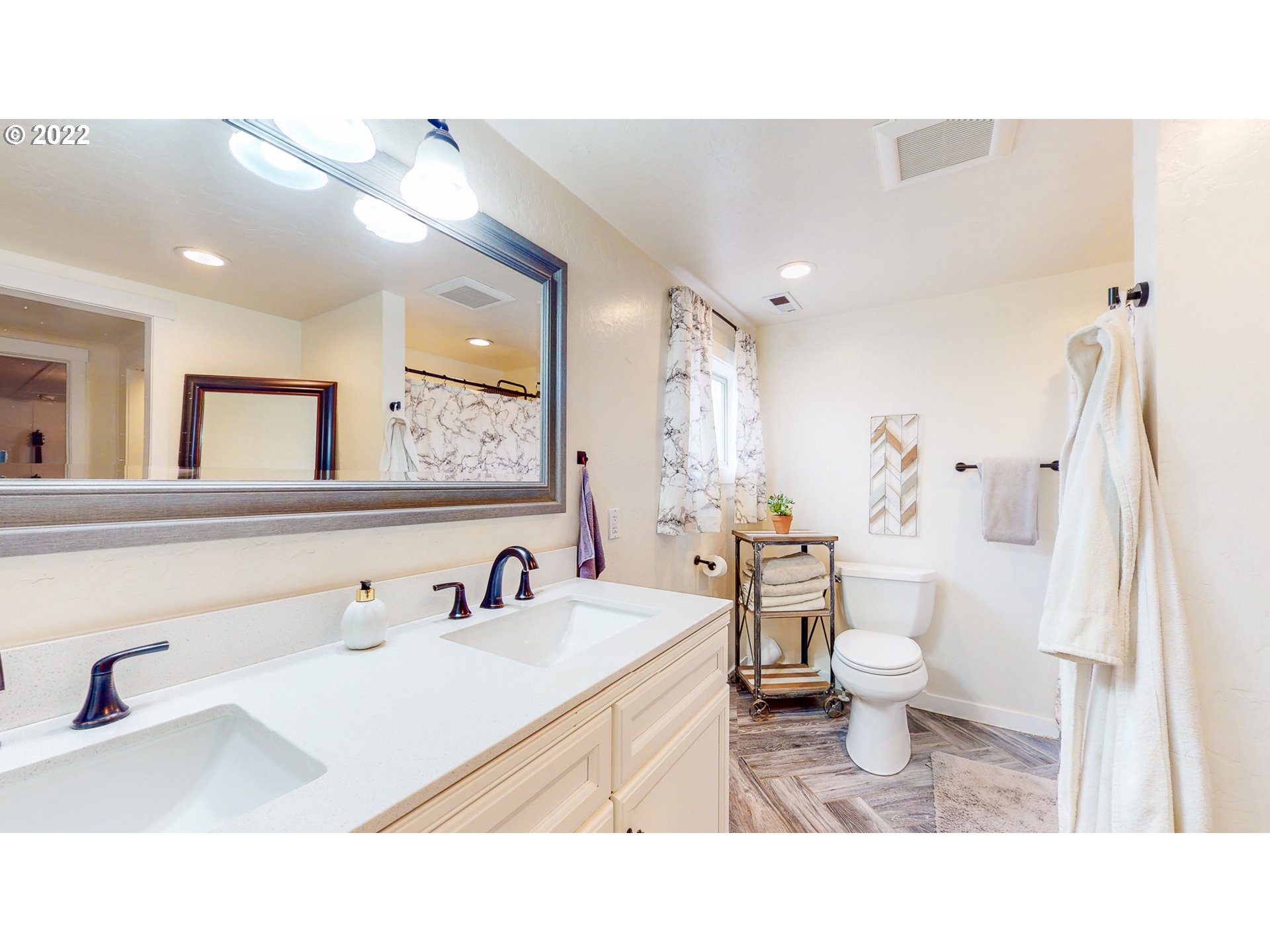 80632 Craig Road Hermiston, OR 97838 - Photo 15 of 25 a bathroom with a sink vanity mirror and toilet