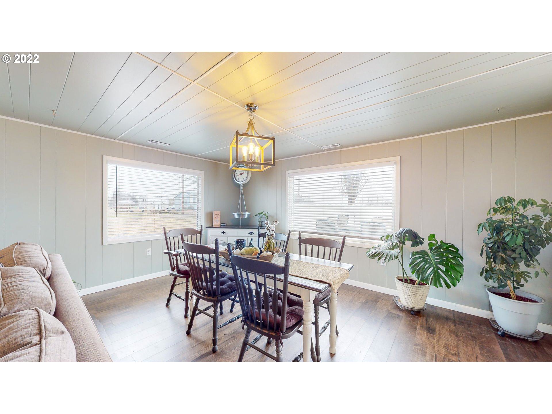 80632 Craig Road Hermiston, OR 97838 - Photo 4 of 25 a view of a dining room with furniture window and wooden floor
