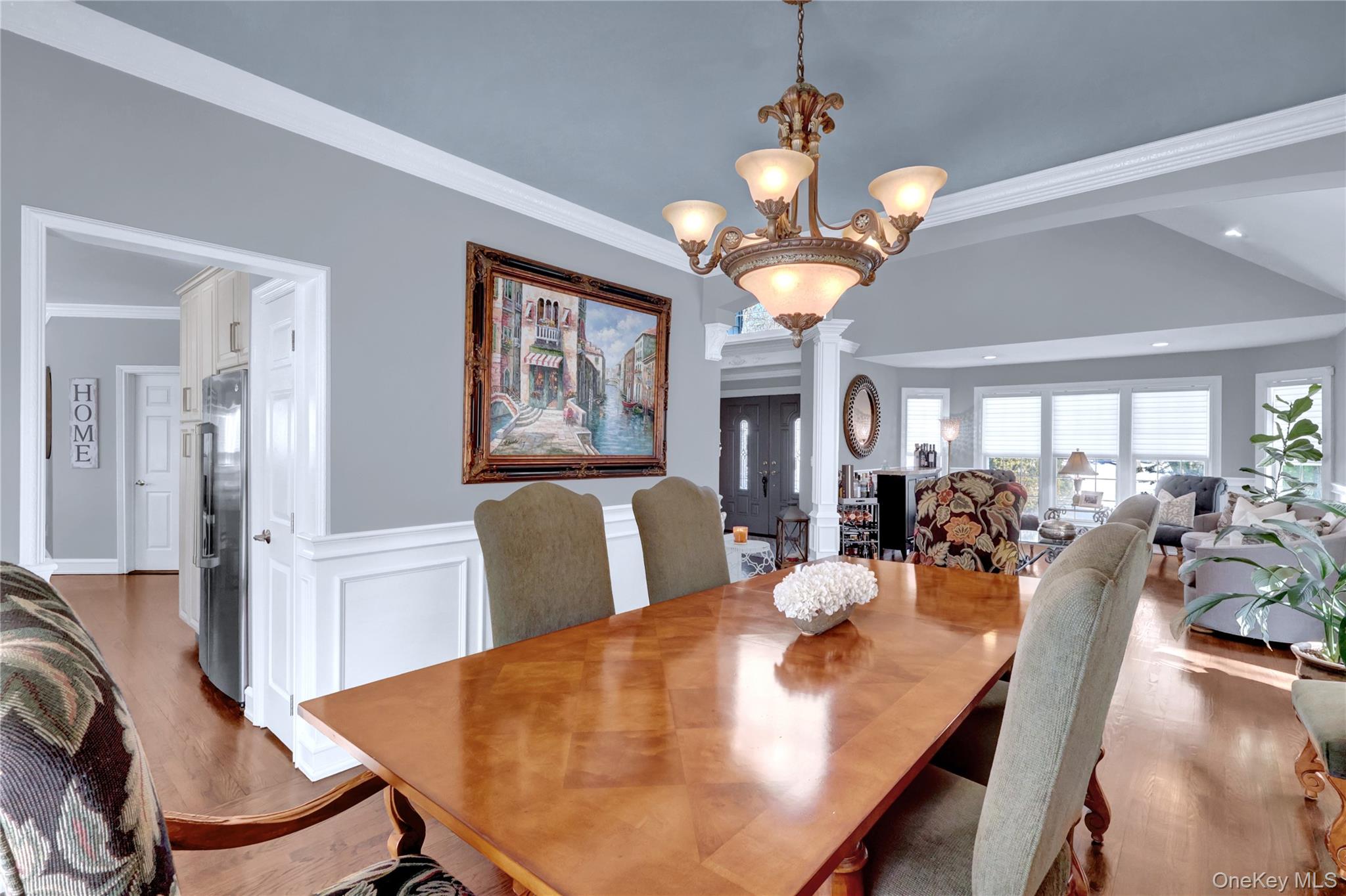 5 Frost Valley Road Mount Sinai, NY 11766 - Photo 10 of 49 a view of a dining room with furniture a chandelier and wooden floor