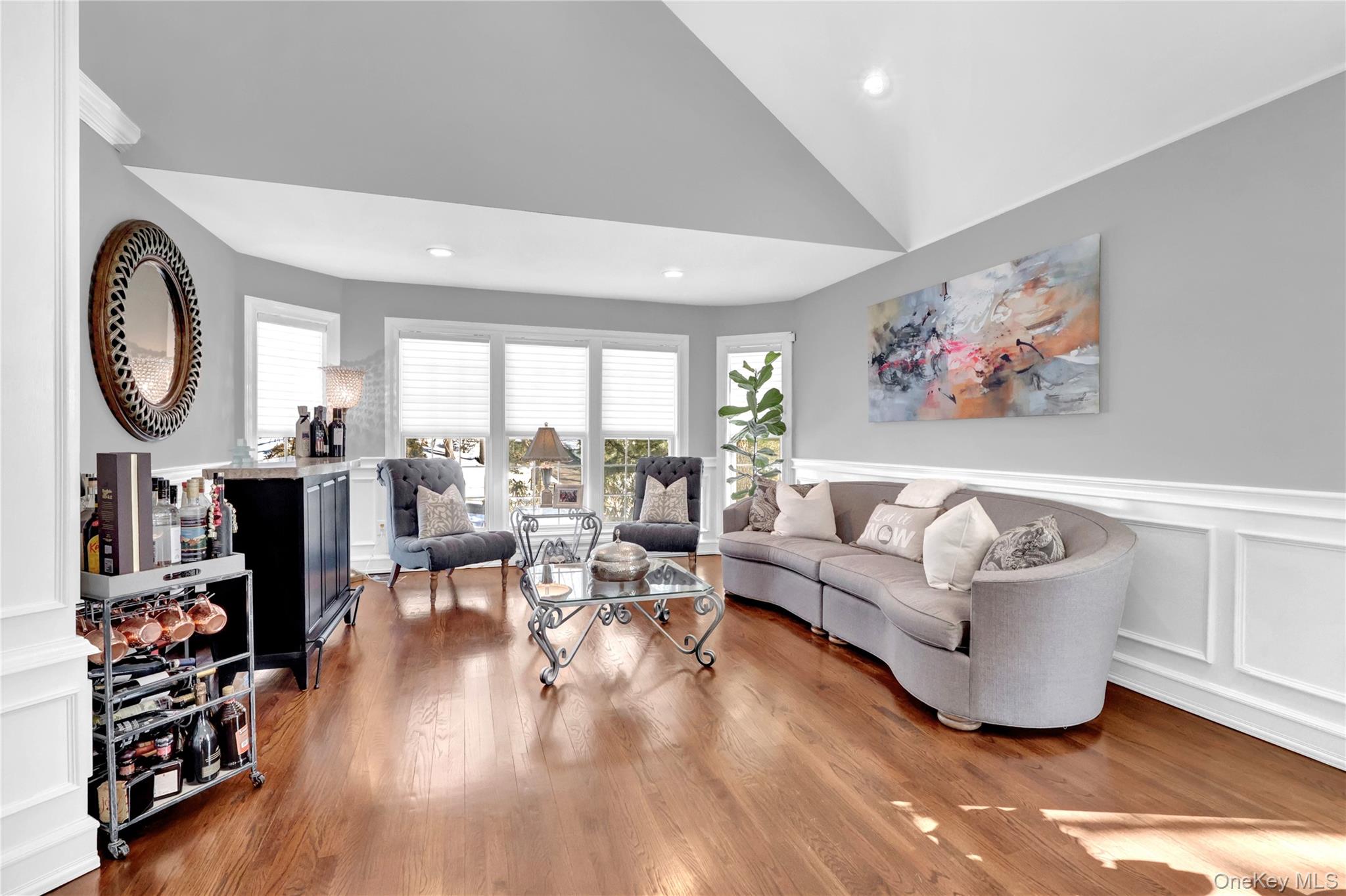 5 Frost Valley Road Mount Sinai, NY 11766 - Photo 11 of 49 a living room with furniture a large window and wooden floor