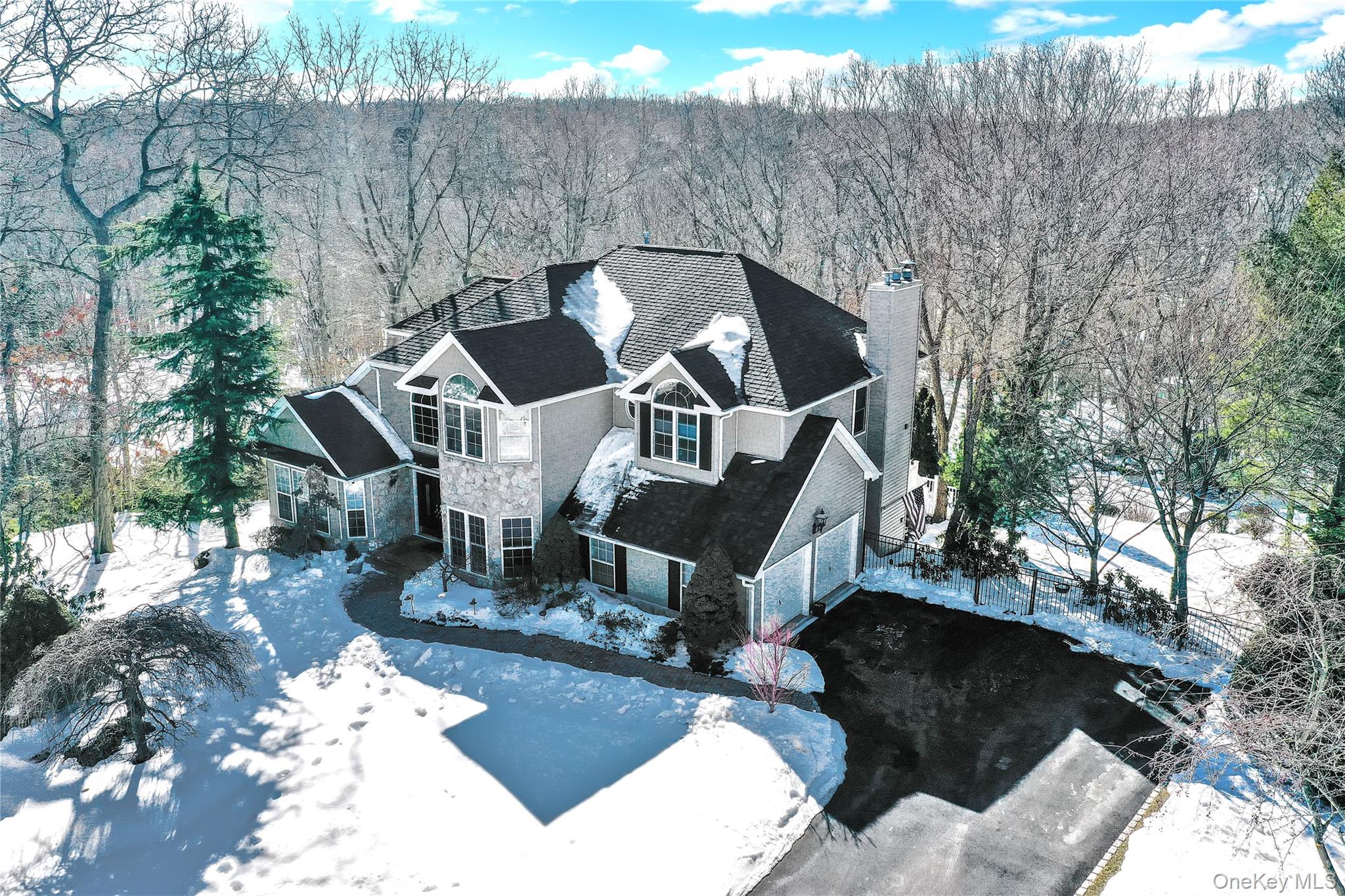 5 Frost Valley Road Mount Sinai, NY 11766 - Photo 2 of 49 a front view of a house with a yard