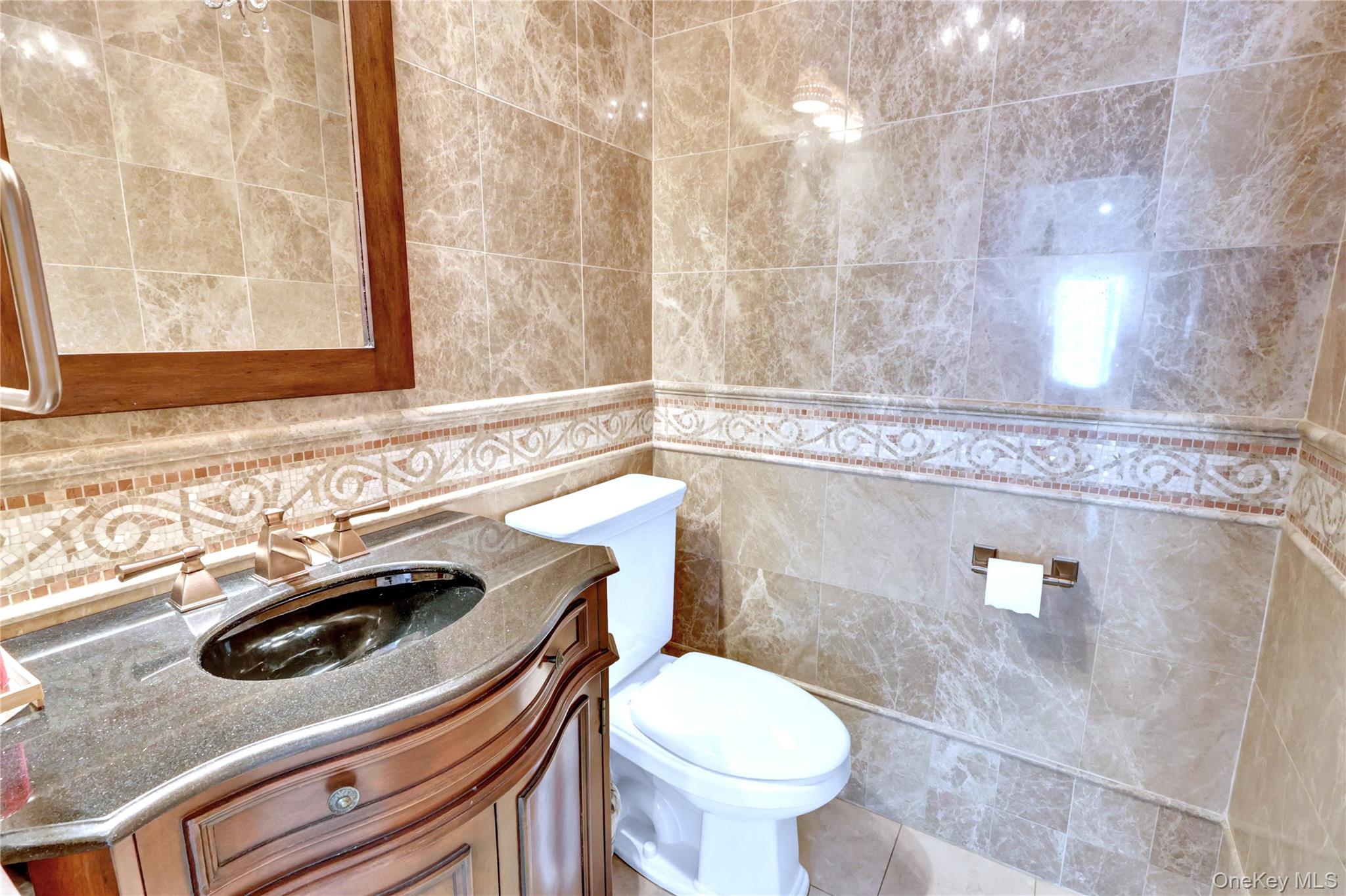 5 Frost Valley Road Mount Sinai, NY 11766 - Photo 20 of 49 a bathroom with a sink a toilet and a mirror