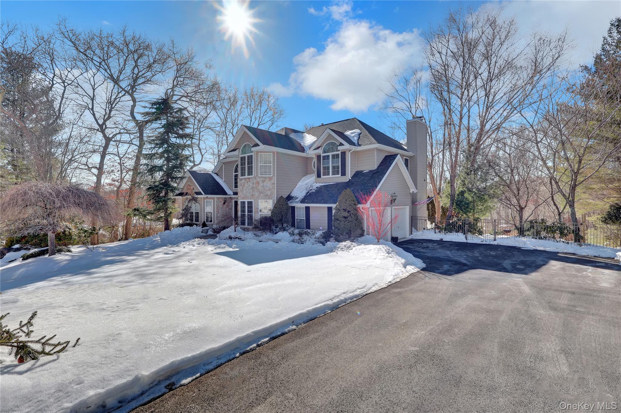 5 Frost Valley Road Mount Sinai, NY 11766 - Photo 39 of 49 a view of a house with a yard covered in snow
