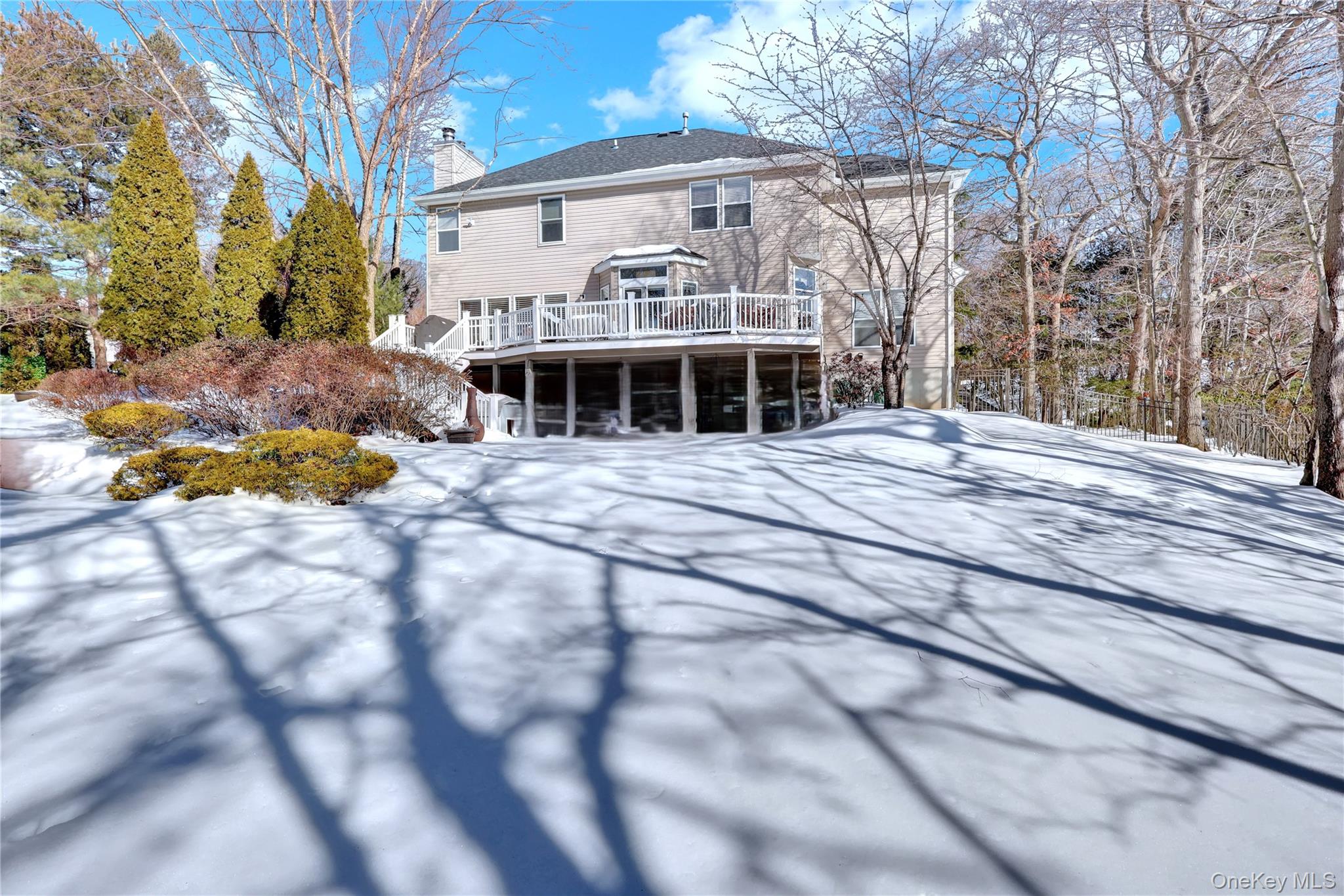 5 Frost Valley Road Mount Sinai, NY 11766 - Photo 41 of 49 a front view of a house with a yard