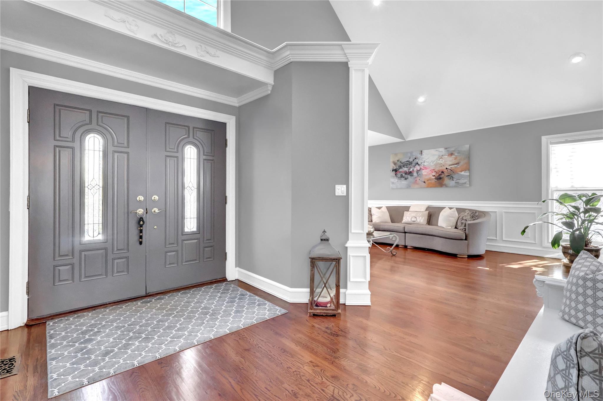 5 Frost Valley Road Mount Sinai, NY 11766 - Photo 7 of 49 a living room with furniture and a wooden floor