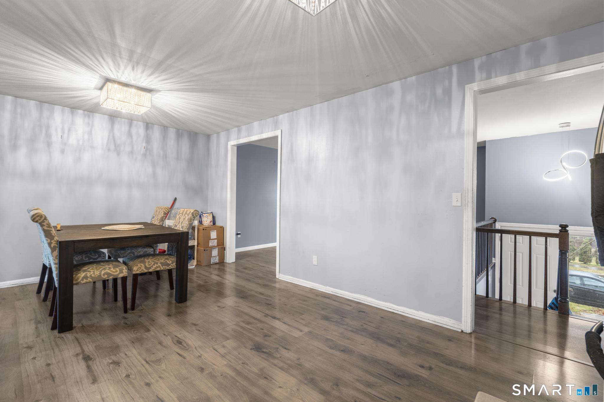 7 Pettit Drive Meriden, CT 06451 - Photo 11 of 35 a view of a dining room with furniture and wooden floor