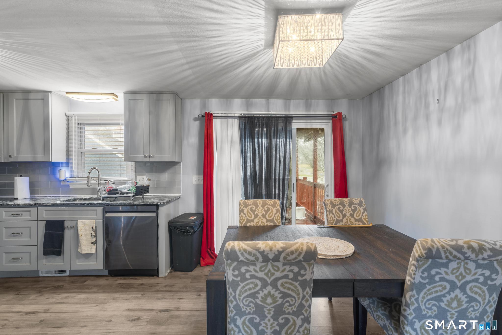 7 Pettit Drive Meriden, CT 06451 - Photo 15 of 35 a kitchen with a stove a sink and a refrigerator