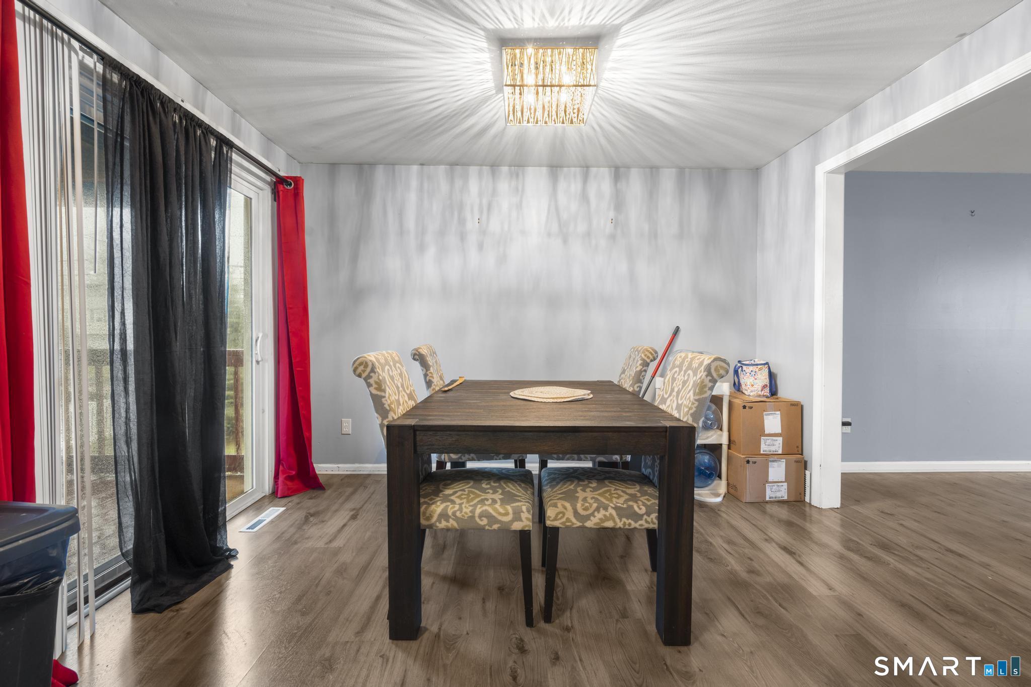 7 Pettit Drive Meriden, CT 06451 - Photo 16 of 35 a view of a dining room with furniture and wooden floor