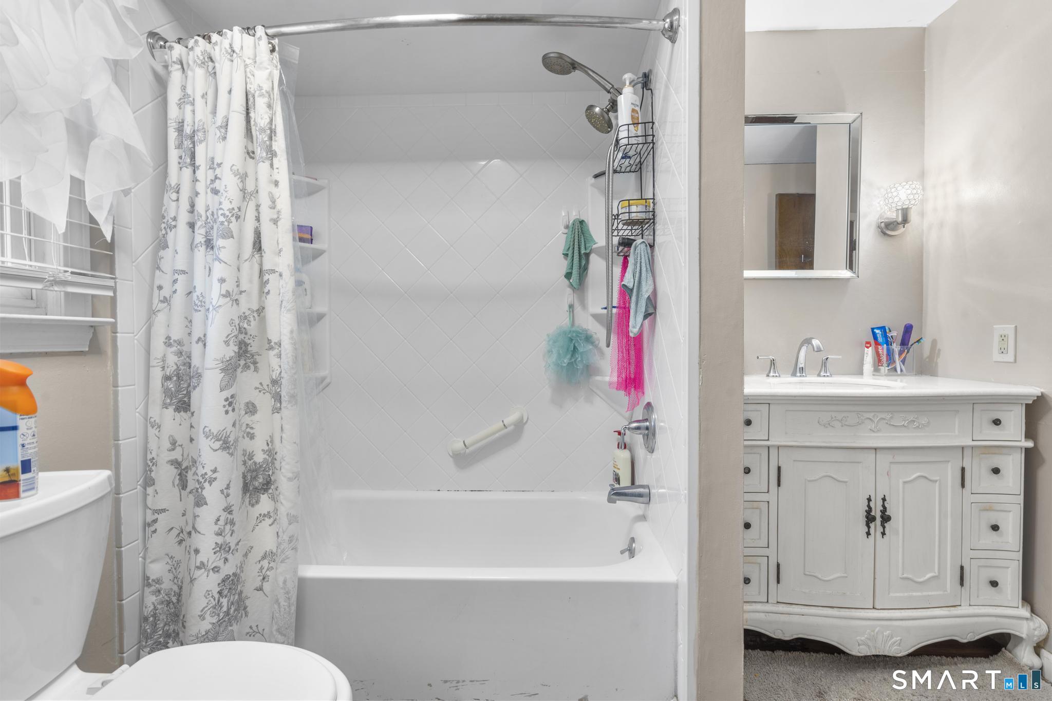 7 Pettit Drive Meriden, CT 06451 - Photo 19 of 35 a bathroom with a sink a toilet and a bathtub