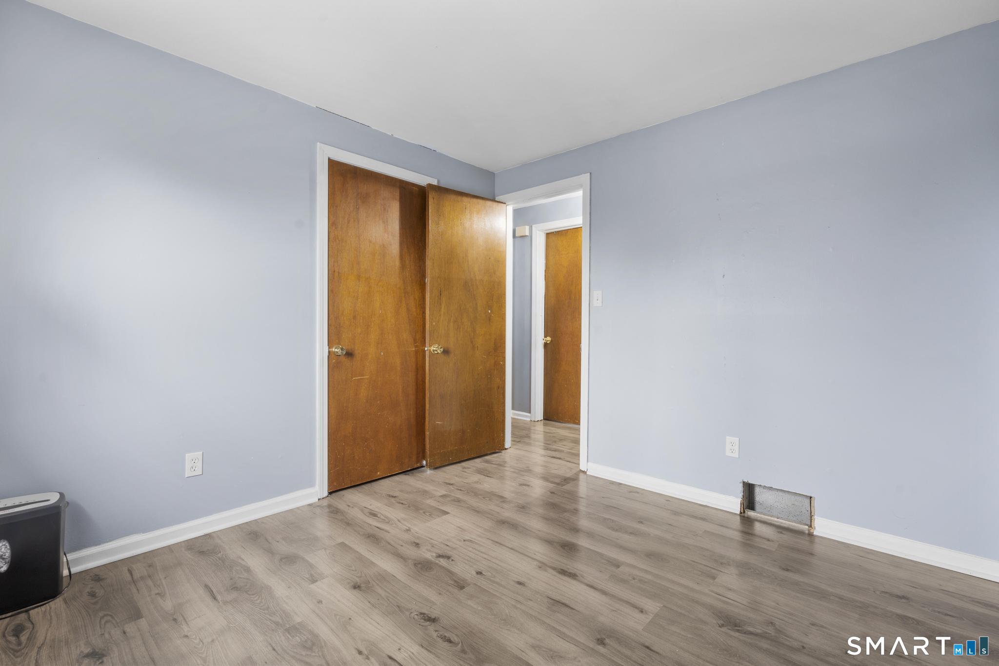 7 Pettit Drive Meriden, CT 06451 - Photo 20 of 35 a view of an empty room with wooden floor