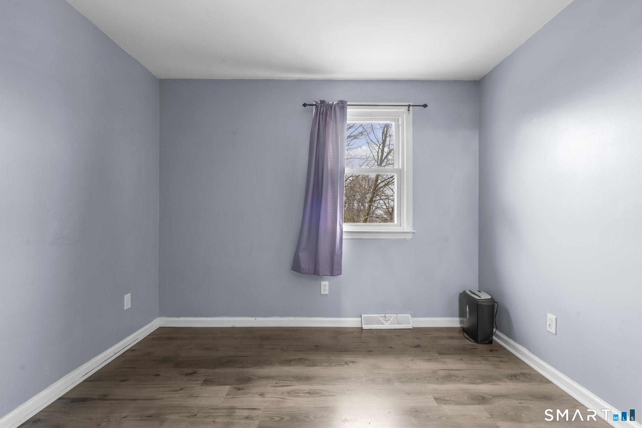 7 Pettit Drive Meriden, CT 06451 - Photo 21 of 35 a view of an empty room and window