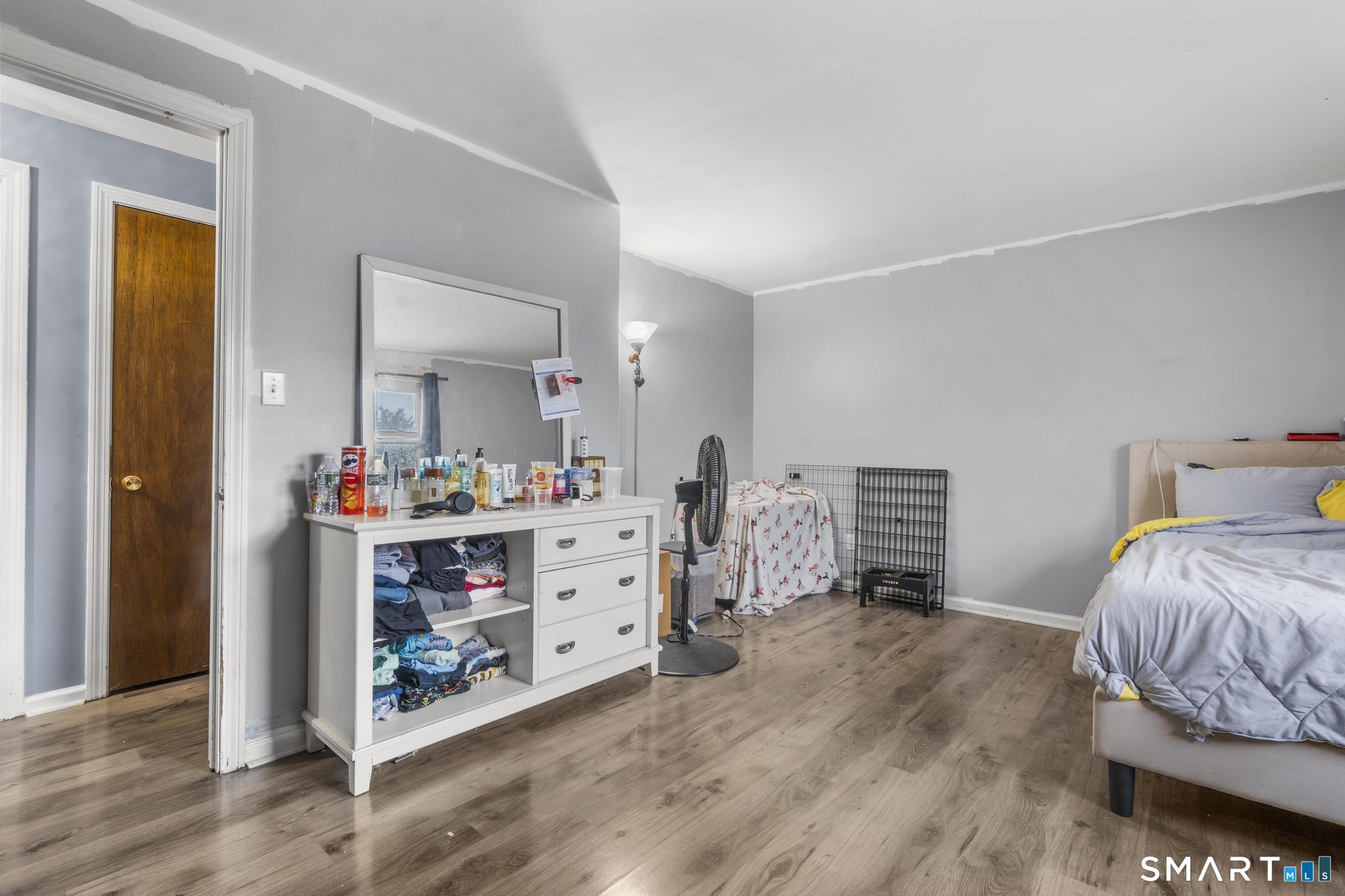 7 Pettit Drive Meriden, CT 06451 - Photo 22 of 35 a bedroom with a bed and a mirror on dresser