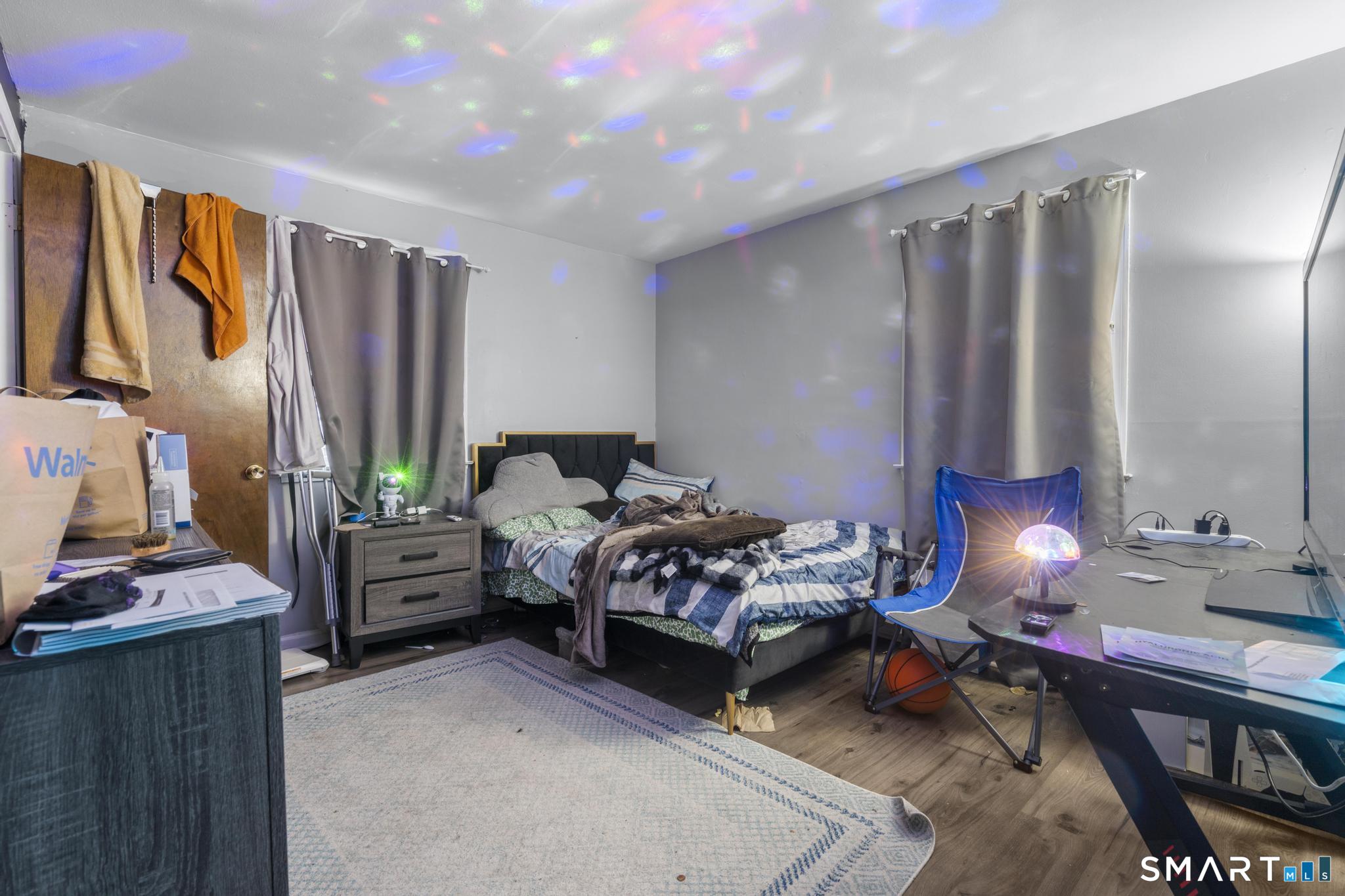 7 Pettit Drive Meriden, CT 06451 - Photo 25 of 35 a bedroom with furniture and a flat screen tv