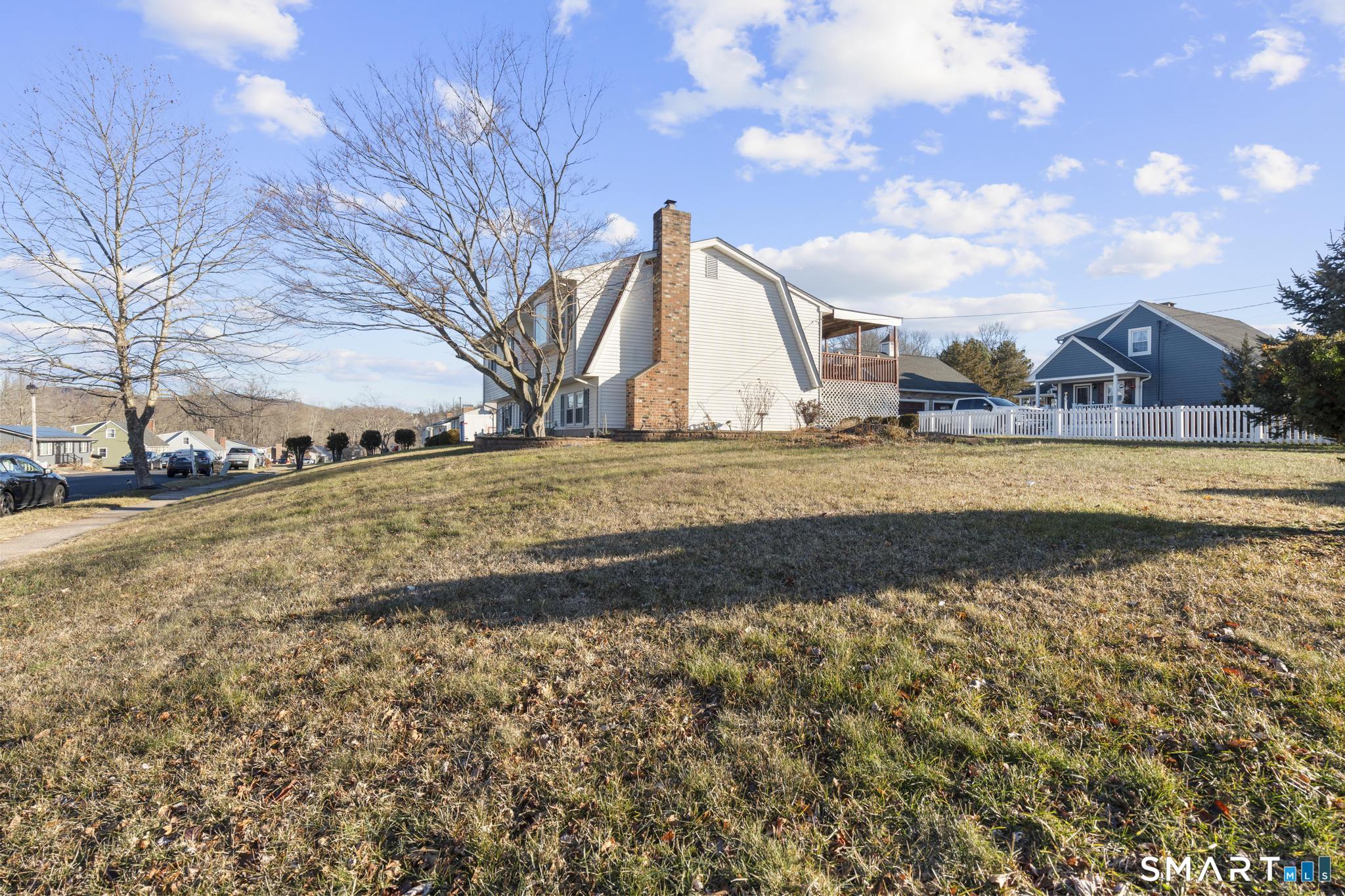 7 Pettit Drive Meriden, CT 06451 - Photo 3 of 35 a view of a field with large trees