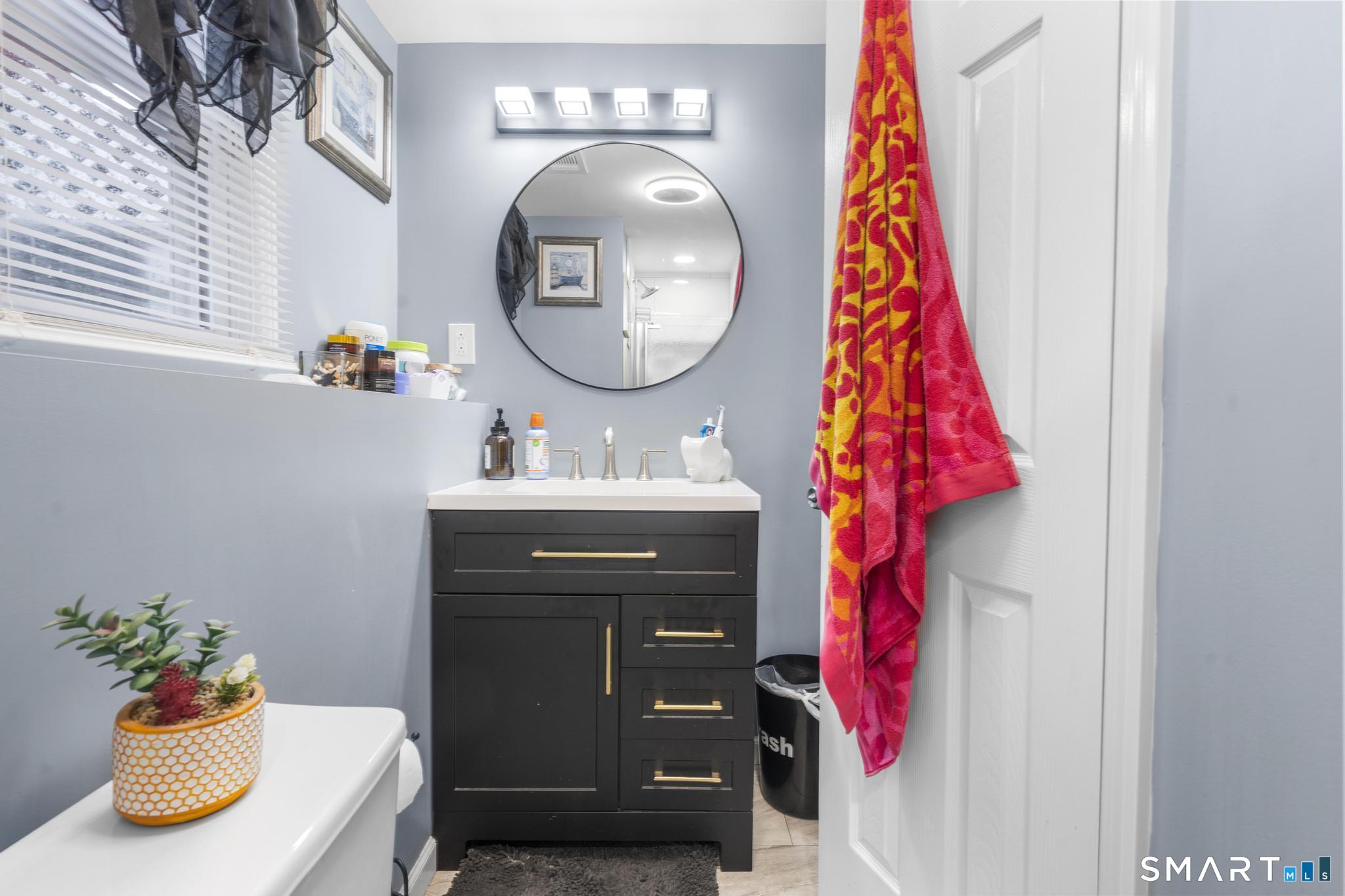 7 Pettit Drive Meriden, CT 06451 - Photo 31 of 35 a bathroom with a sink vanity and a mirror