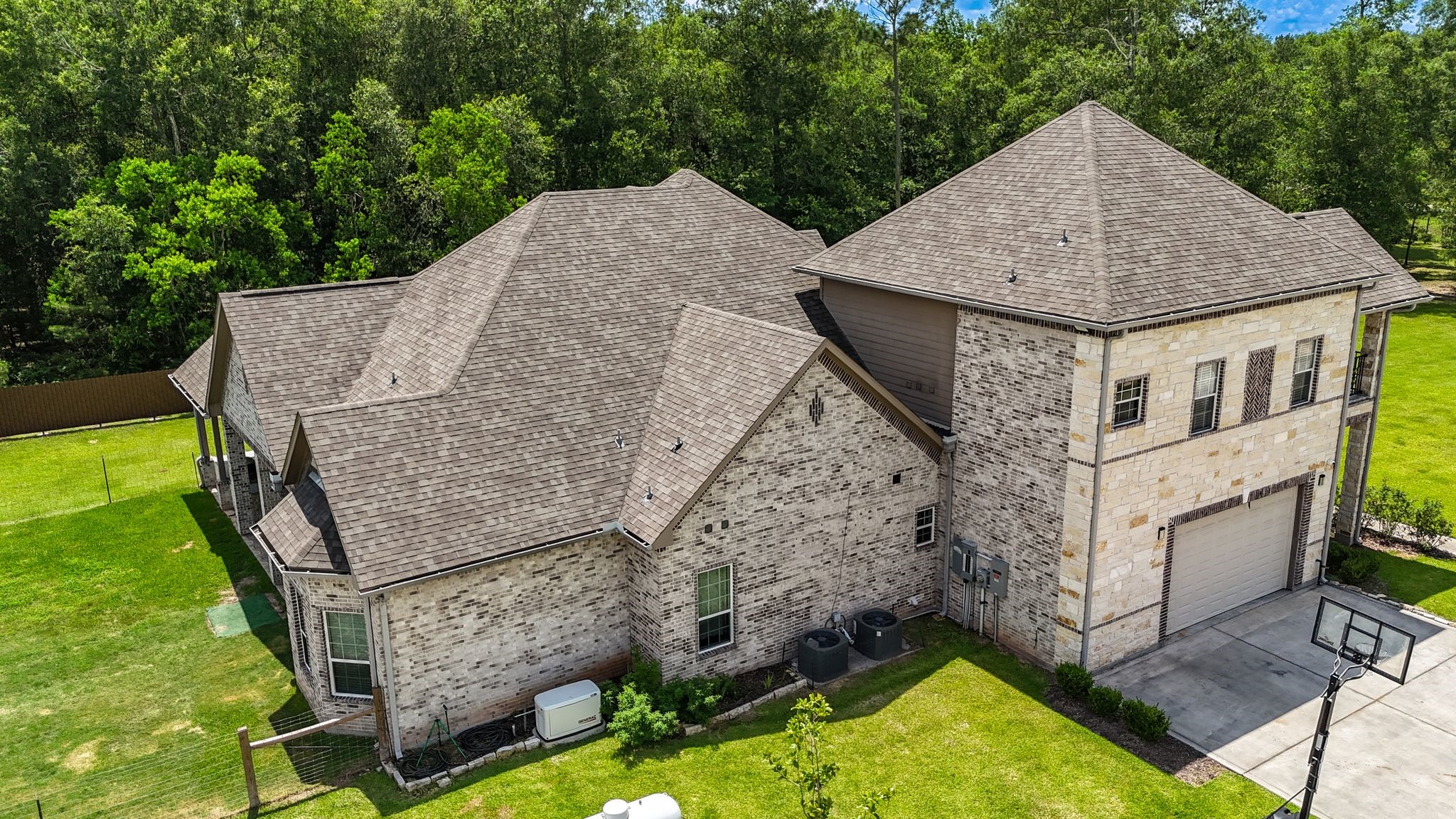 21038 Angus Drive Cleveland, TX 77328 - Photo 6 of 49 an aerial view of a house with swimming pool and large trees