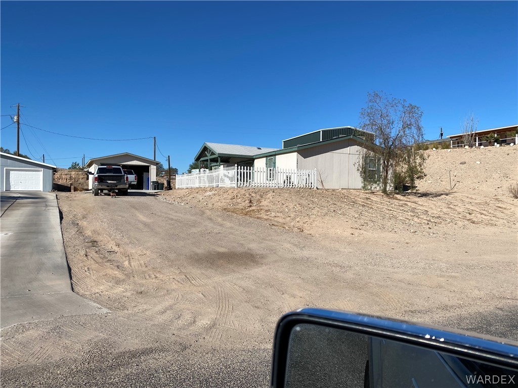 13411 South Water Reed Way Topock, AZ 86436 - Photo 1 of 18 a view of backyard with car parked