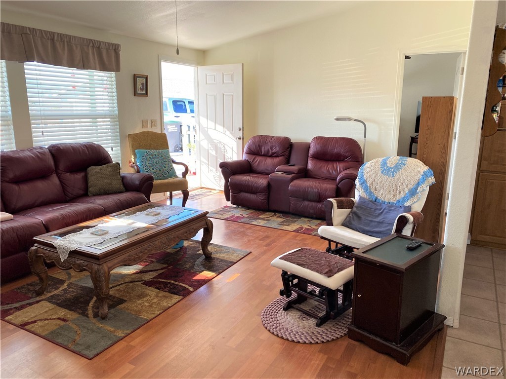 13411 South Water Reed Way Topock, AZ 86436 - Photo 5 of 18 a living room with furniture a wooden floor and a window