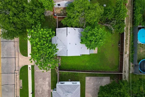 swimming pool with a garden and trees