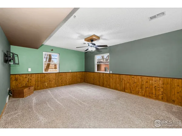 a view of entryway and hall with a living room